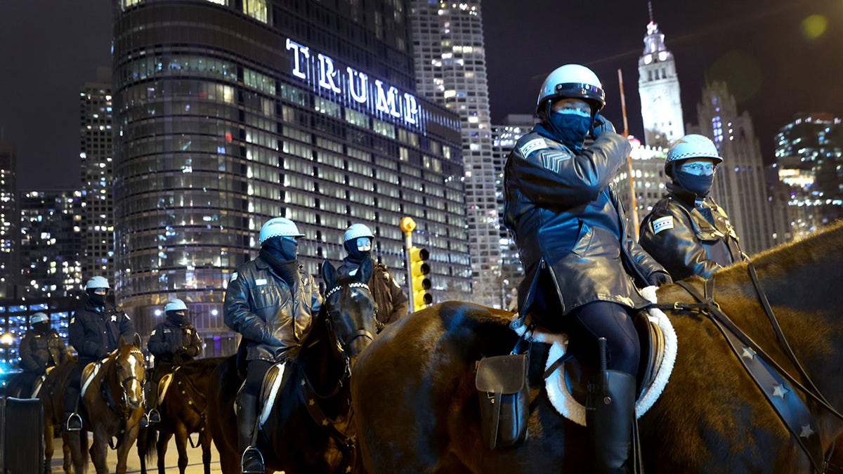 Police keep watch as a small group of demonstrators protest near Trump Tower on January 07, 2021 in Chicago, Illinois.  (Photo by Scott Olson/Getty Images)