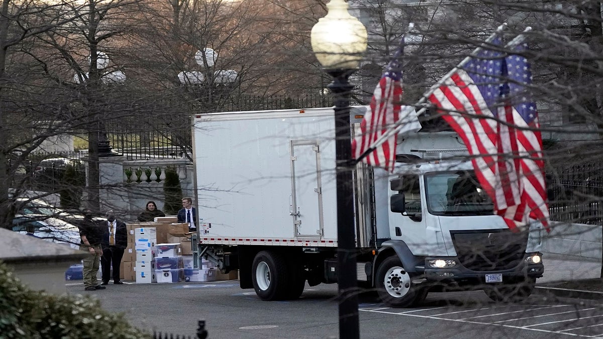 A van arrives to pick up boxes that were moved out of the Eisenhower Executive Office building. (AP)