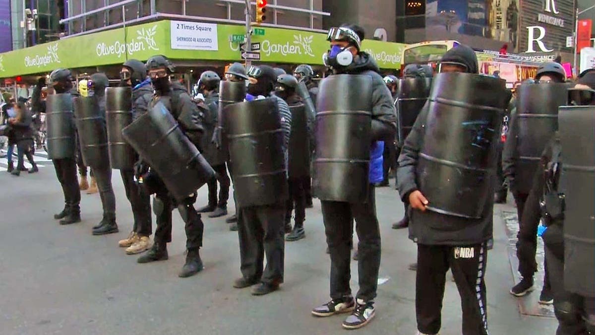 Antifa protesters carrying shields and wearing helmets marched through New York City in January 2021.