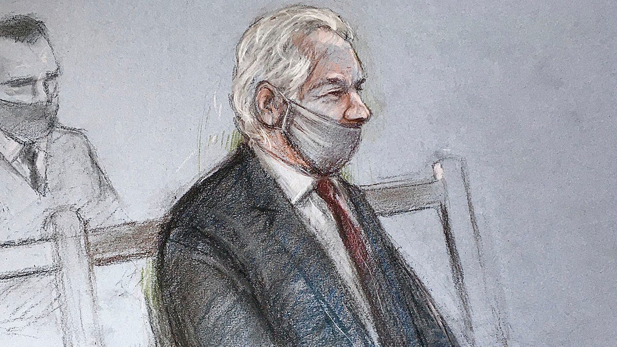 This is a court artist sketch by Elizabeth Cook of Julian Assange appearing at the Old Bailey in London for the ruling in his extradition case in London on Monday. (AP)
