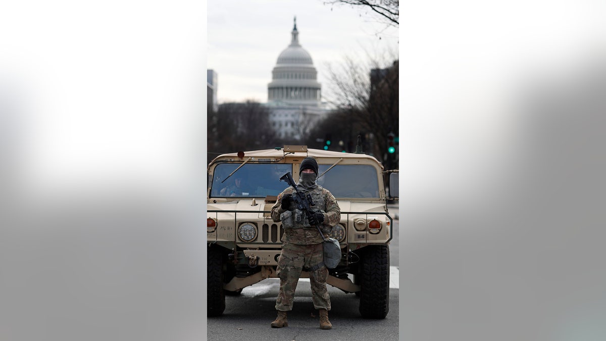 A National Guard stands on patrol outside the Capitol as security is heightened ahead of President-elect Joe Biden's inauguration ceremony Monday, Jan. 18, 2021, in Washington.