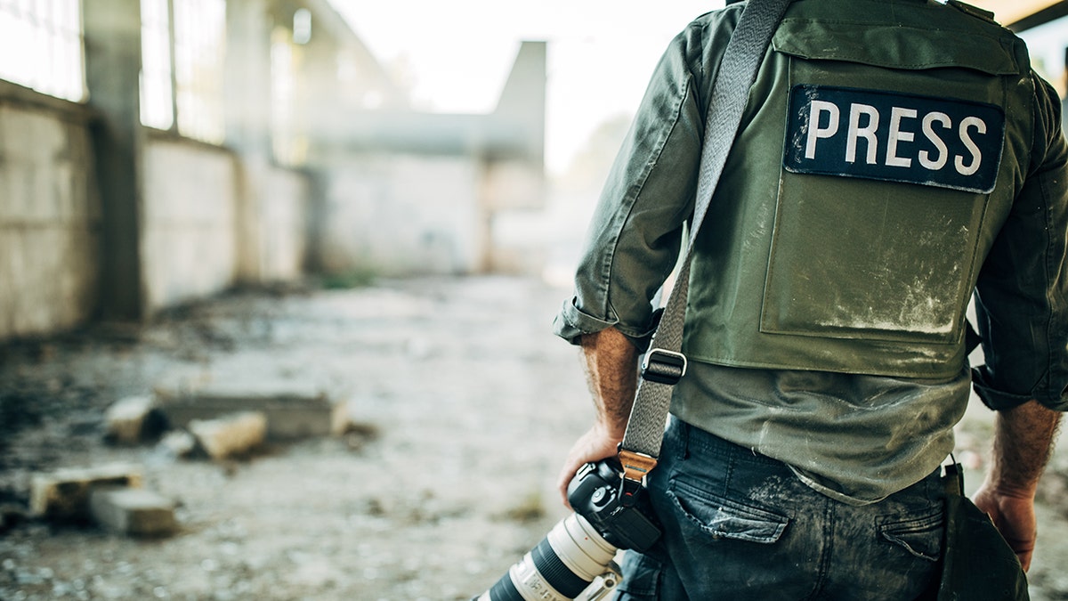 Journalist wears bulletproof vest. (iStock)