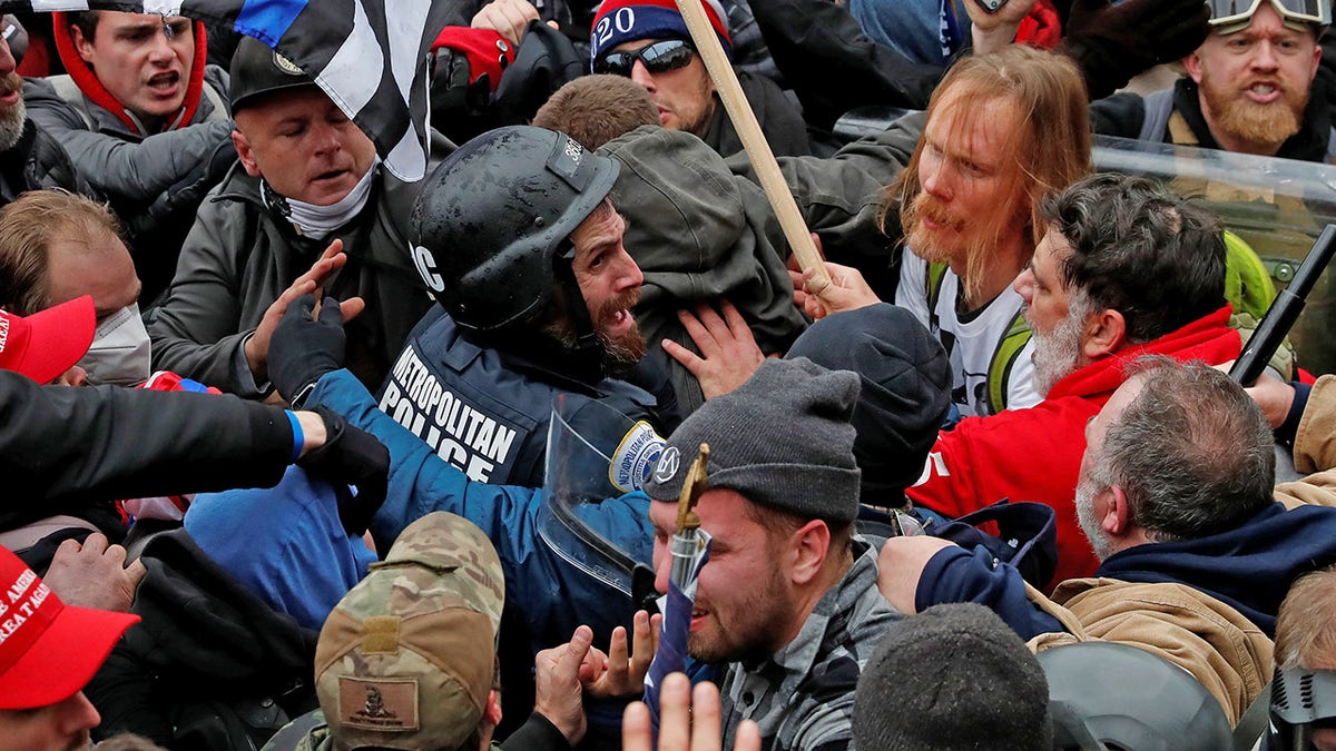 Pro-Trump protesters clash with police during a rally to contest the certification of the 2020 U.S. presidential election results by the U.S. Congress, at the U.S. Capitol Building in Washington, U.S, January 6, 2021. Picture taken January 6, 2021. REUTERS/Shannon Stapleton