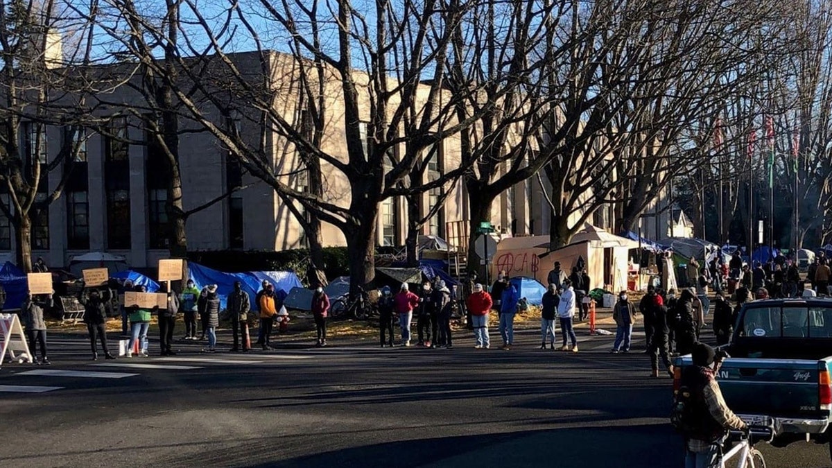 This undated photo shows protesters outside of Bellingham's City Hall where a homeless encampment has taken root.