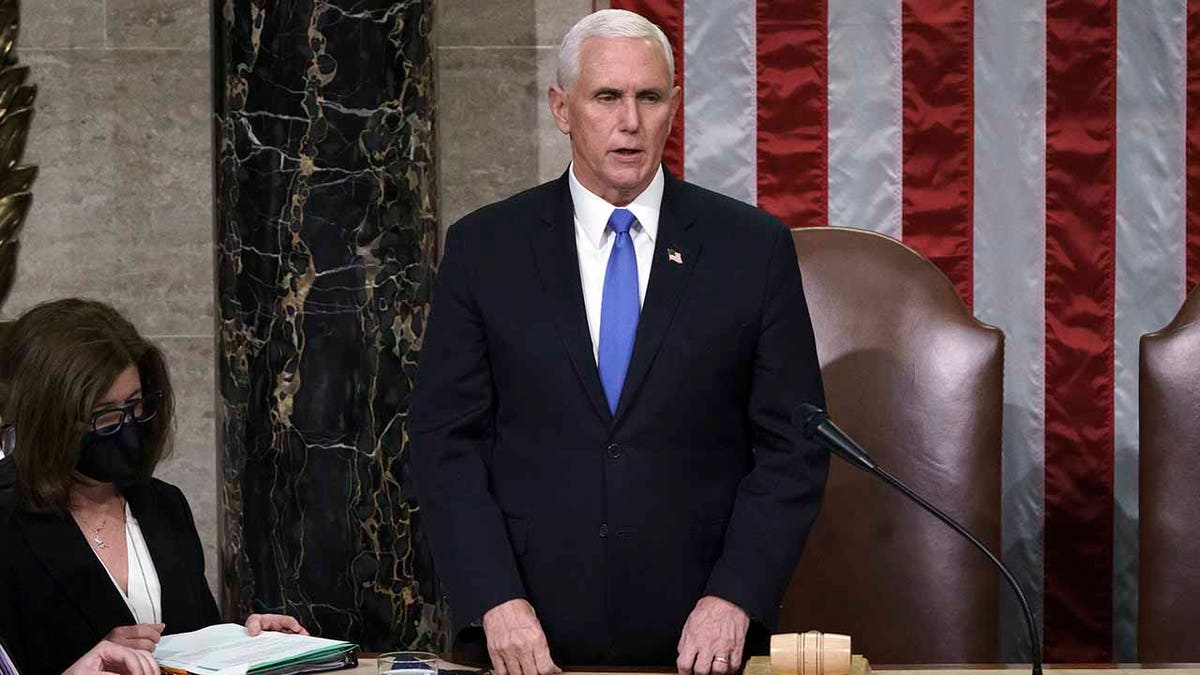 Vice President Mike Pence listens after reading the final certification of Electoral College votes cast in November's presidential election during a joint session of Congress after working through the night, at the Capitol in Washington, Thursday, Jan. 7, 2021. Violent protesters loyal to President Donald Trump stormed the Capitol Wednesday, disrupting the process. (AP Photo/J. Scott Applewhite, Pool)