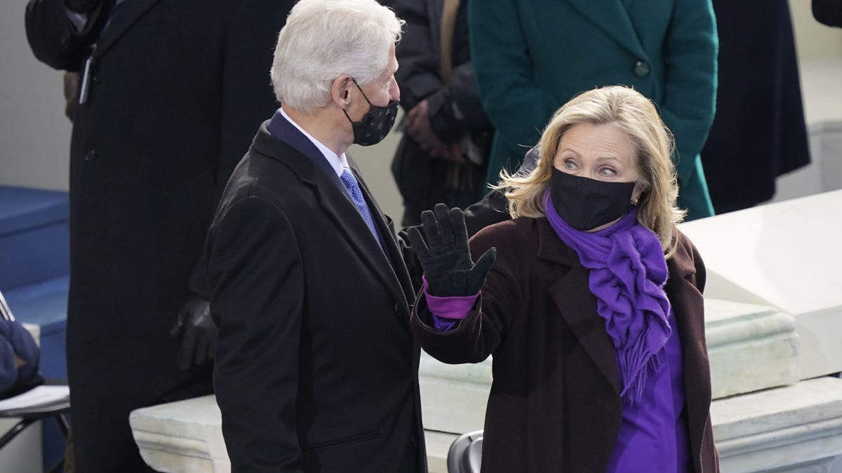 Former President Bill Clinton and former Secretary of State Hillary Clinton arrive for the 59th Presidential Inauguration at the U.S. Capitol in Washington, Wednesday, Jan. 20, 2021. (AP Photo/Carolyn Kaster)