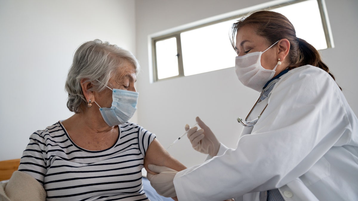 older person getting vaccine