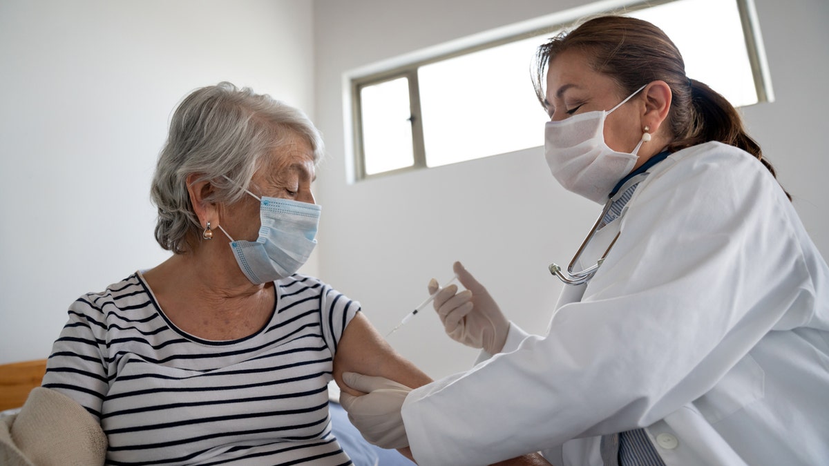 older person getting vaccine