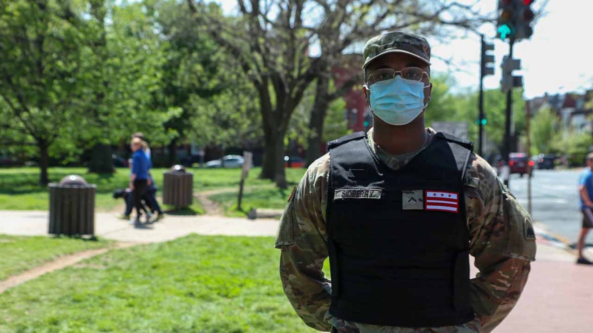 D.C. National Guardsman wears a black identification vest instead of a camouflage option.