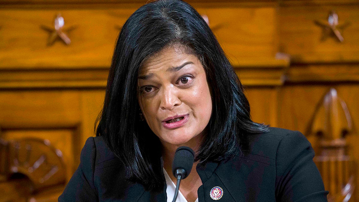 Rep. Pramila Jayapal speaking into a microphone