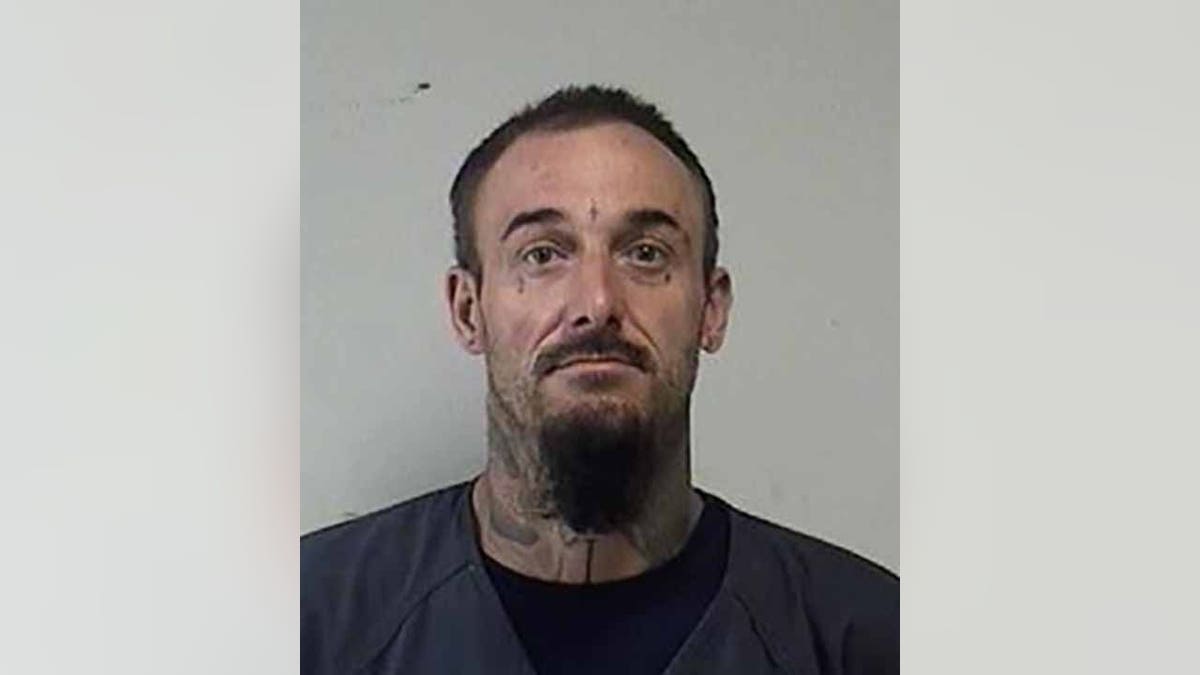 Joshua Ziminski, 35, of Racine, was charged with arson, disorderly conduct with a dangerous weapon and obstructing an officer. (Kenosha County Sheriff's Office)