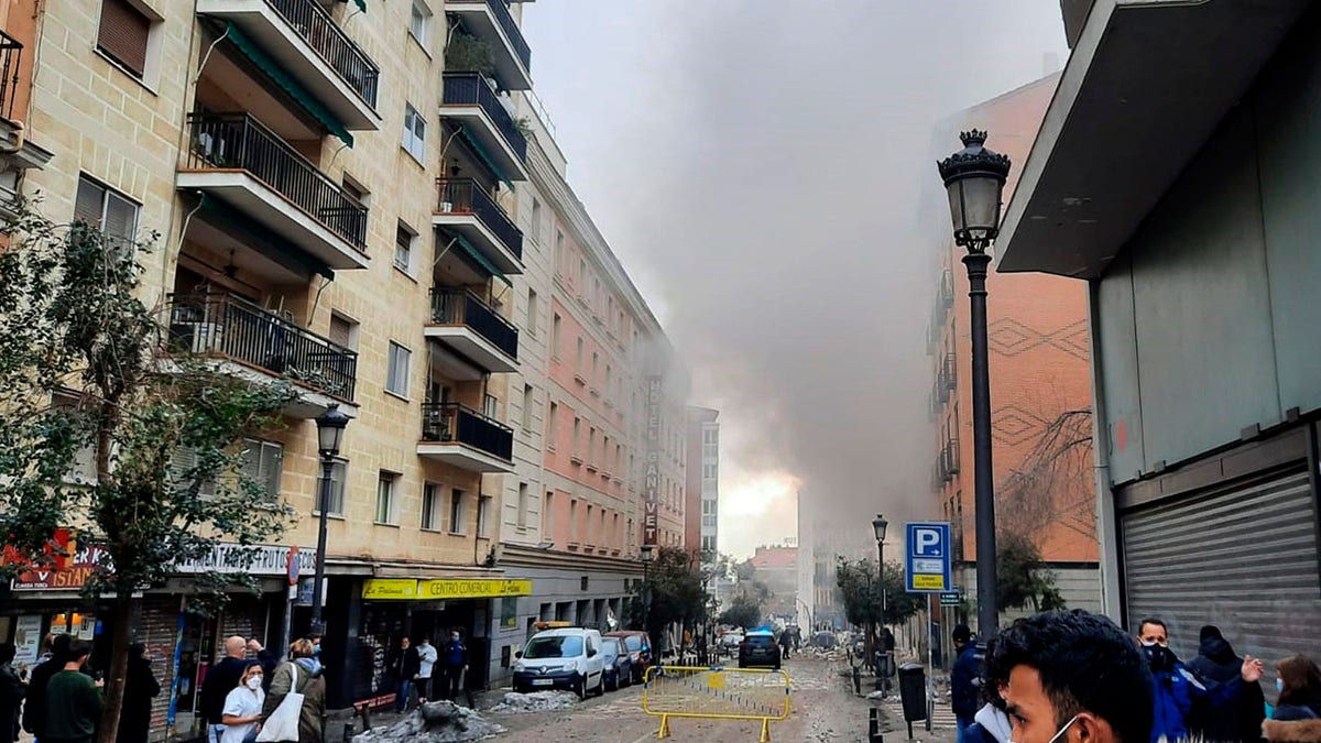 A loud explosion of unknown origin has partially destroyed a six-floor-tall building flanked by a school and a nursing home in the center of Spain's capital, Madrid. (Europa Press via AP)