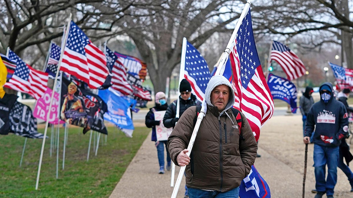 Supporters of US President Donald Trump challenging the results of the 2020 US Presidential election arrive for a rally on the Ellipse outside of the White House on January 6, 2021 in Washington, DC. (Photo by Alex Edelman / AFP) (Photo by ALEX EDELMAN/AFP via Getty Images)