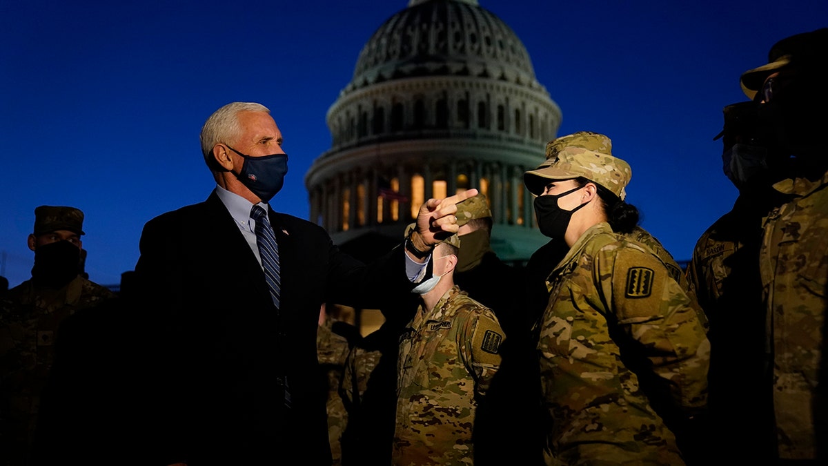 Vice President Mike Pence speaks to National Guard troops outside the U.S. Capitol, Thursday, Jan. 14, 2021, in Washington. (AP Photo/Alex Brandon, Pool)