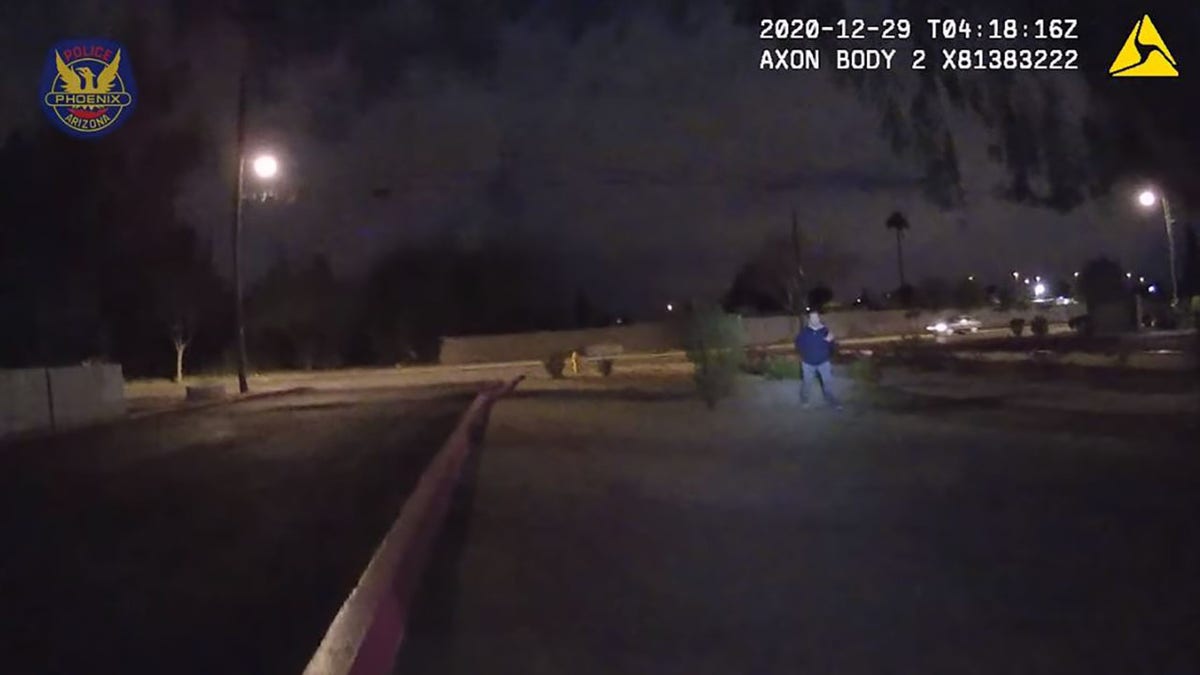 Crawford ignored officers and continued to walk backward with his hand behind his back. He can be heard several times saying, "Who's going to kill someone tonight?"