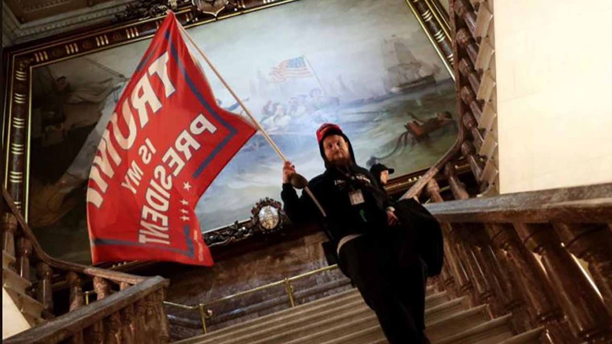 Nicholas Rodean, 26, of Frederick, Md., was photographed inside the U.S. Capitol on Jan. 6 waving a "Trump is My President" flag. 