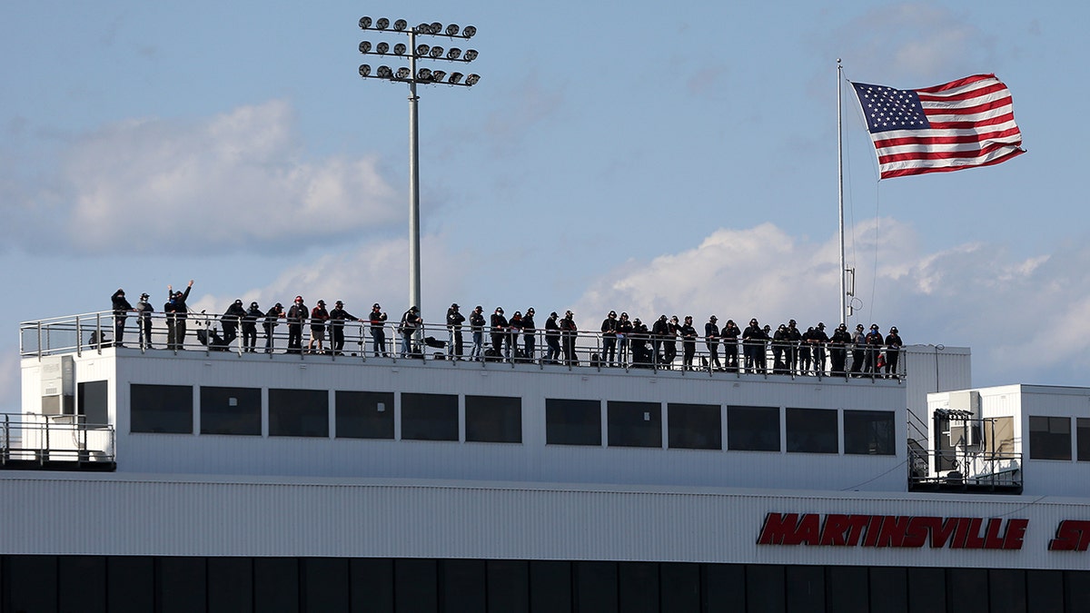 Spotters keep an eye on the race from a platform above the grandstand and radio information to their drivers about what's happening around them on the track.