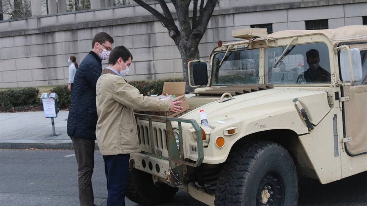 Sen. Pat Toomey's staff prepare to distribute candy care packages on Jan. 15, 2021, to National Guard members stationed in force at the Capitol.