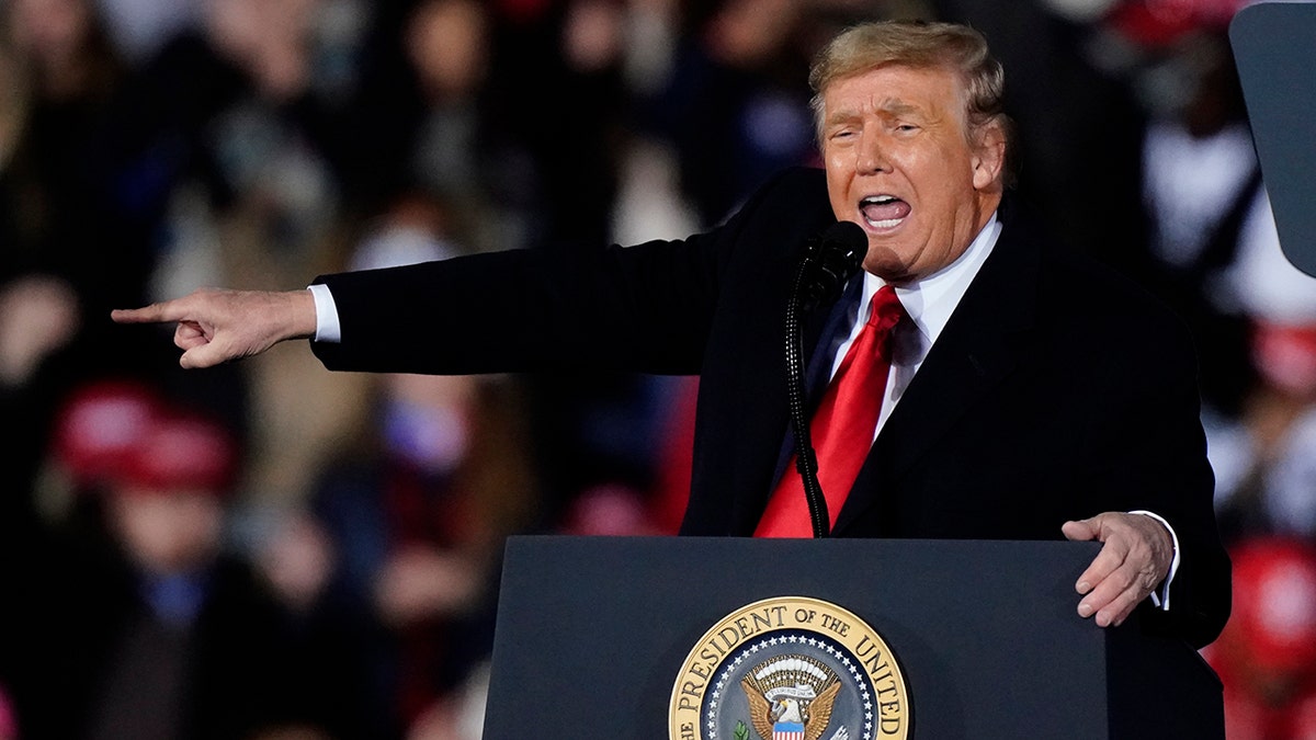 President Donald Trump speaks at a campaign rally in support of Senate candidates Sen. Kelly Loeffler, R-Ga., and David Perdue in Dalton, Ga., Monday, Jan. 4, 2021. (AP Photo/Brynn Anderson)