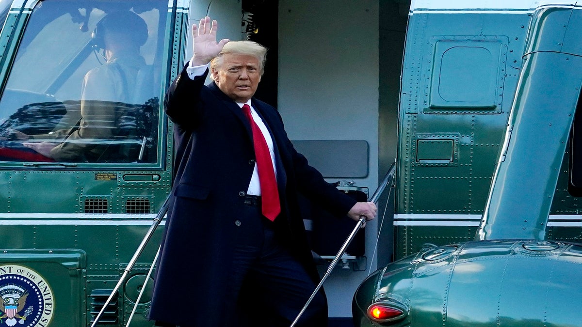 President Donald Trump waves as he boards Marine One on the South Lawn of the White House