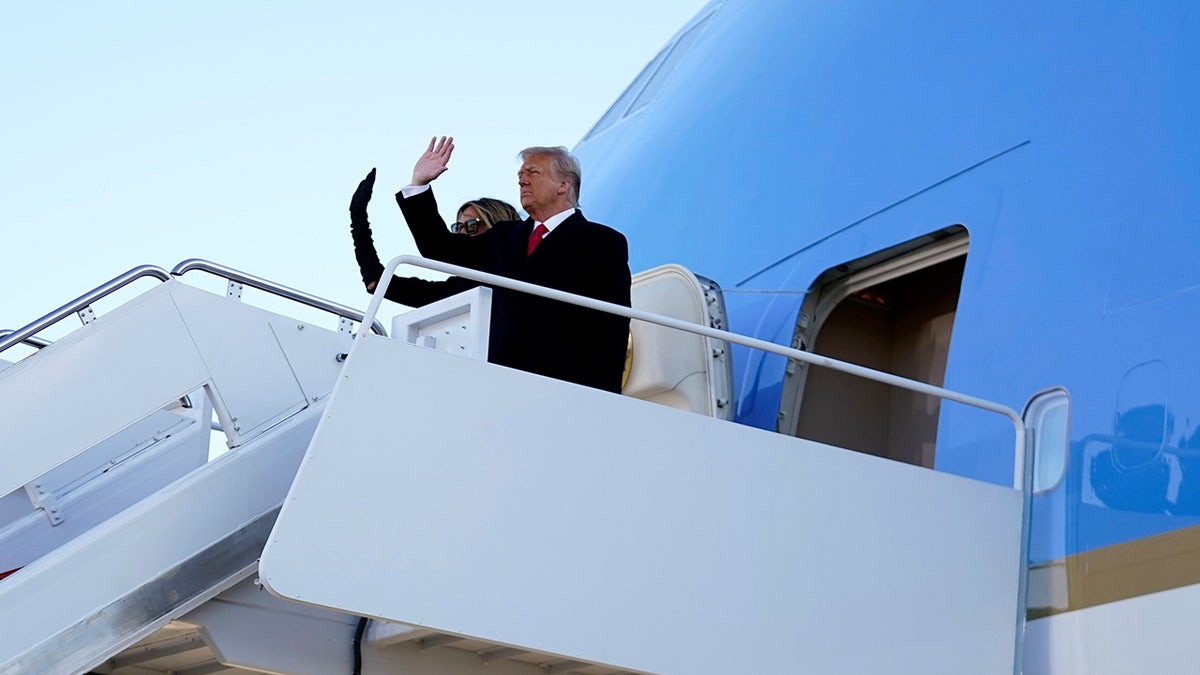 President Donald Trump and first lady Melania Trump board Air Force One at Andrews Air Force Base, Md., Wednesday, Jan. 20, 2021.(AP Photo/Manuel Balce Ceneta)