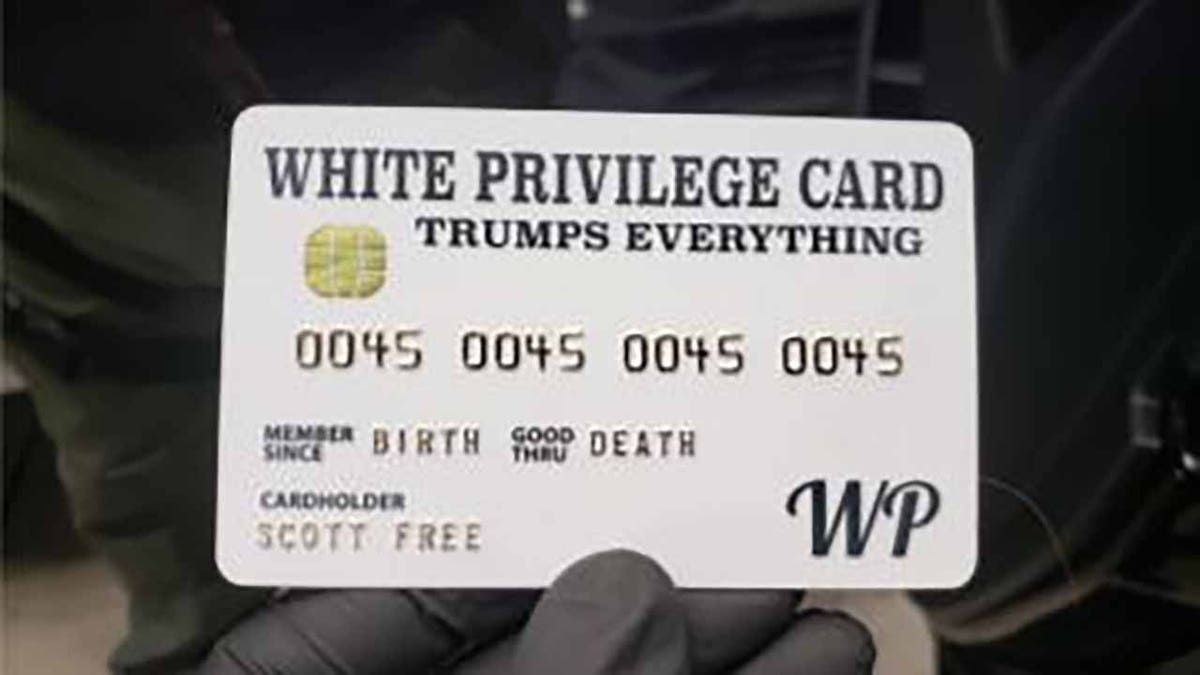 Officers found a "White Privilege Card" while executing search warrants on Rogers' home and business. (Justice Department)