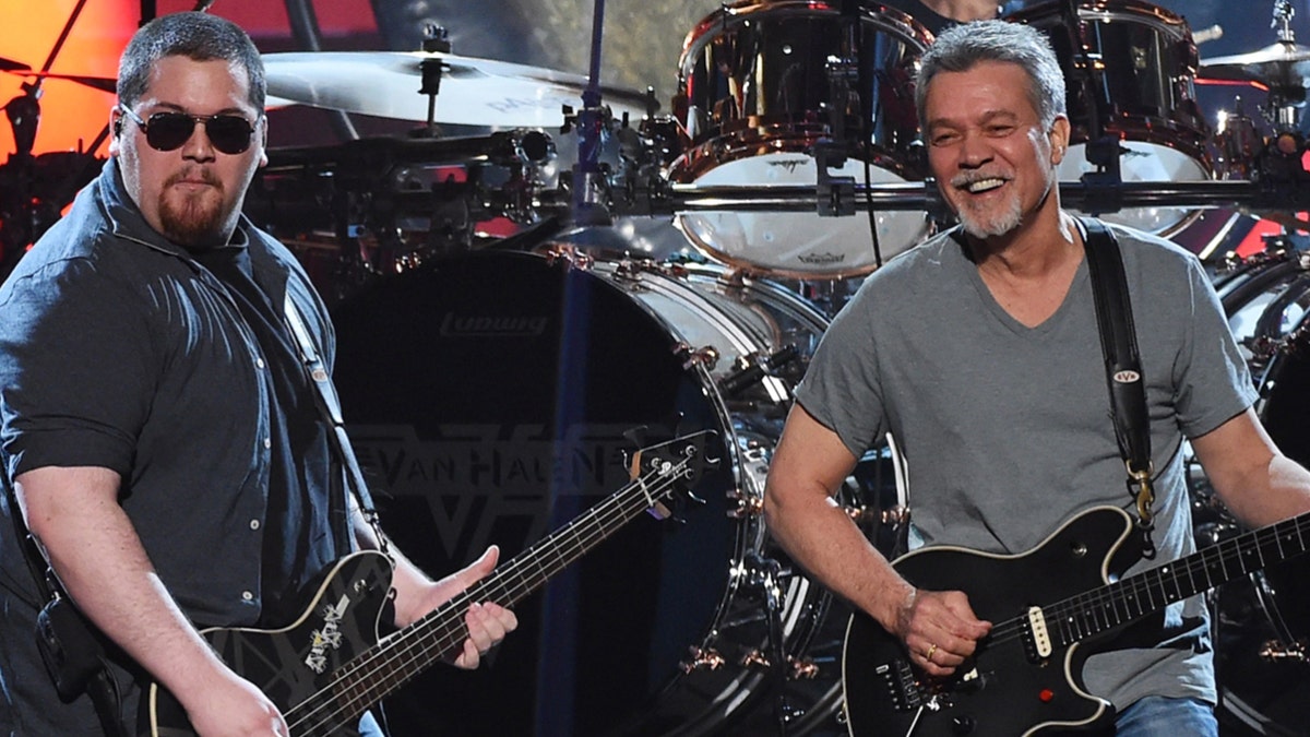 Wolf Van Halen, left, penned a touching tribute to his late father, Eddie Van Halen, to commemorate what would've been the rocker’s 66th birthday on Tuesday. Eddie Van Halen died at the age of 65 in October.