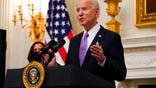 President Joe Biden speaks about the coronavirus, accompanied by Vice President Kamala Harris, in the State Dinning Room of the White House, Thursday, Jan. 21, 2021, in Washington. (AP Photo/Alex Brandon)
