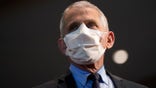 FILE - In this Dec. 22, 2020, file photo, Dr. Anthony Fauci, director of the National Institute of Allergy and Infectious Diseases, speaks before receiving his first dose of the COVID-19 vaccine at the National Institutes of Health, in Bethesda, Md. Fauci’s quick commitment to the WHO — whose response to the pandemic has been criticized by many, but perhaps most vociferously by the Trump administration — marks a dramatic and vocal shift toward a more cooperative approach to fighting the pandemic. (AP Photo/Patrick Semansky, Pool, File)