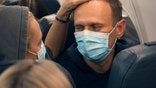 Alexei Navalny and his wife Yulia sit on the plane on a flight to Moscow, at the Airport Berlin Brandenburg (BER) in Schoenefeld, near Berlin, Germany, Sunday, Jan. 17, 2021.