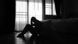 Silhouette of depressed man sitting in the private room
