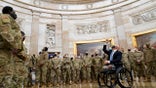 Rep. Brian Mast, R-Fla., gives troops a tour in the Rotunda on Capitol Hill in Washington, Wednesday, Jan. 13, 2021. (AP Photo/Susan Walsh)