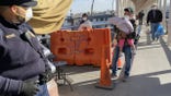 A man holds his child at a border stop in Juarez, Mexico.