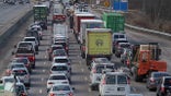 CANTON, MA - DECEMBER 7: A truck on Rte 93 in Canton, MA rolled over and the contents were spilled across the highway, causing a rare pandemic sight of a long traffic jam on the highway on Dec. 7, 2020. (Photo by Suzanne Kreiter/The Boston Globe via Getty Images)