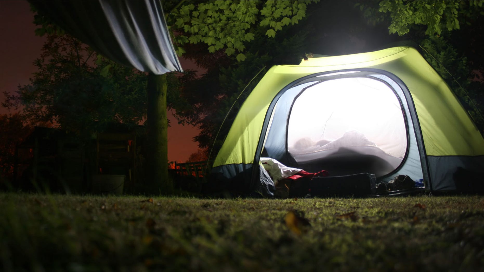 Family says landlord moved into their backyard, is living in a tent