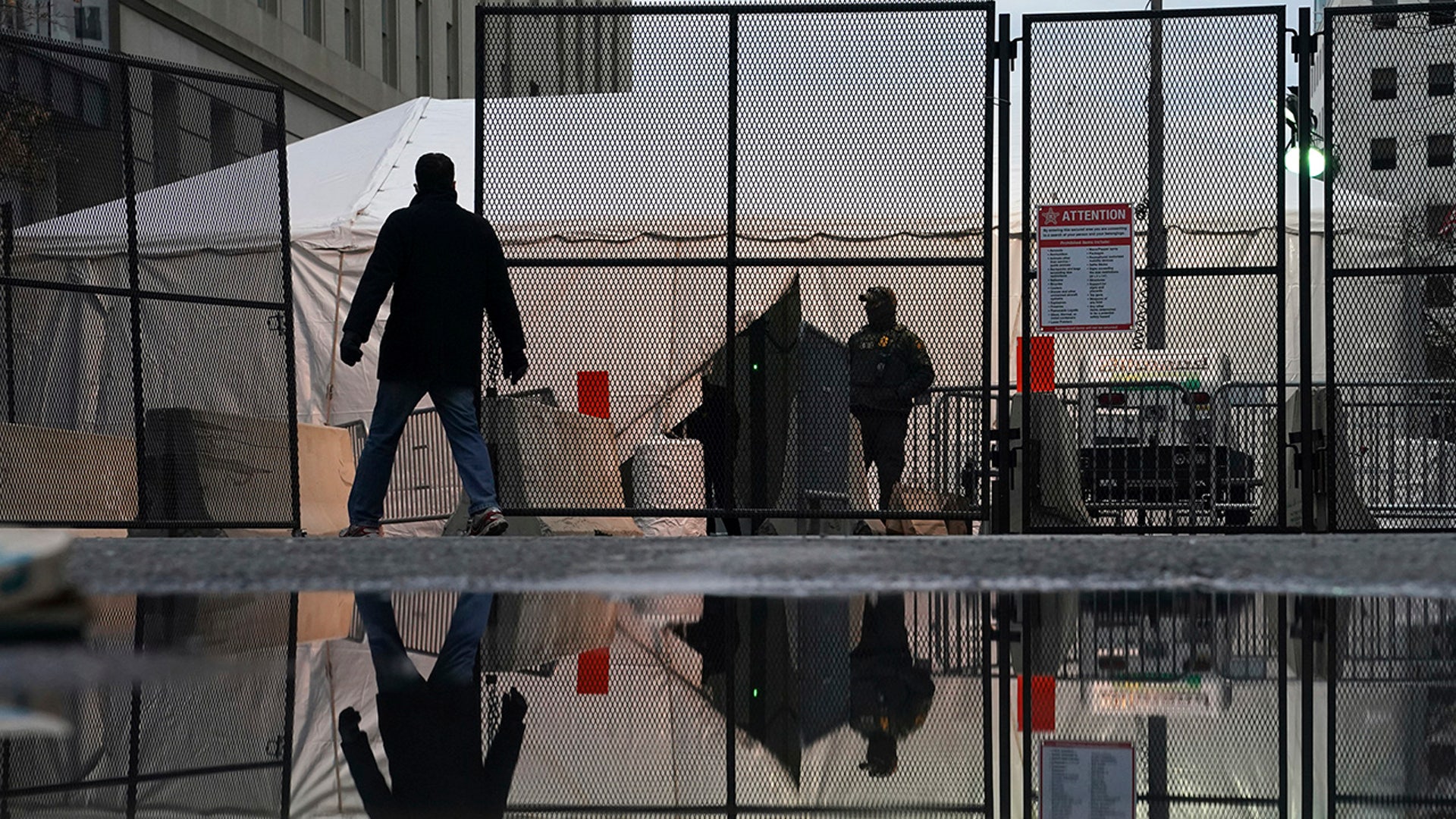 National Guard work a security checkpoint ahead of the inauguration of President-elect Joe Biden and Vice President-elect Kamala Harris, Sunday, Jan. 17, 2021, in Washington.