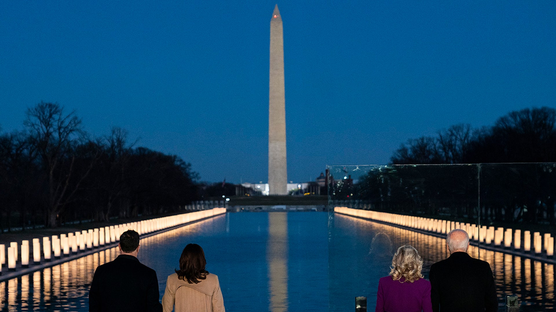 President-elect Joe Biden and his wife, Jill Biden, are joined by Vice President-elect Kamala Harris and her husband, Doug Emhoff, during a COVID-19 memorial event at the Lincoln Memorial Reflecting Pool, Tuesday, Jan. 19, 2021, in Washington.
