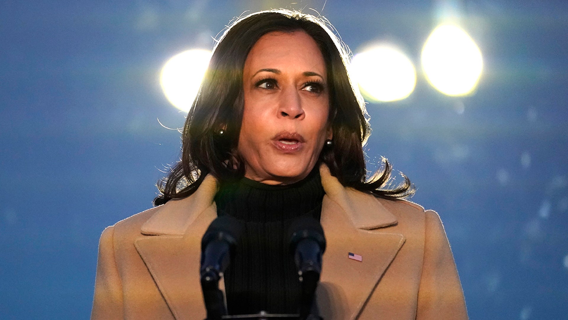 Vice President-elect Kamala Harris speaks during a COVID-19 memorial, with lights placed around the Lincoln Memorial Reflecting Pool, Tuesday, Jan. 19, 2021, in Washington.