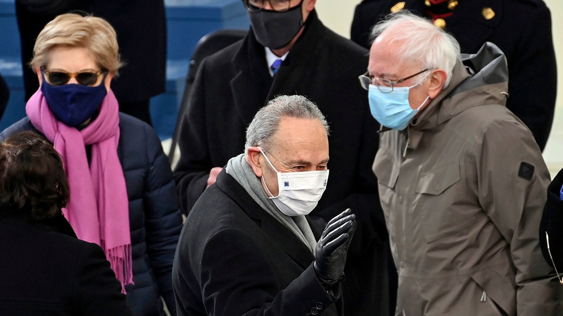 Sen. Elizabeth Warren, left, D-Mass., Senate Majority leader Chuck Schumer, center. D-N.Y., and Sen. Bernie Sanders, I-Vt., wait before President-elect Joe Biden’s inauguration, Wednesday, Jan. 20, 2021, at the U.S. Capitol in Washington.
