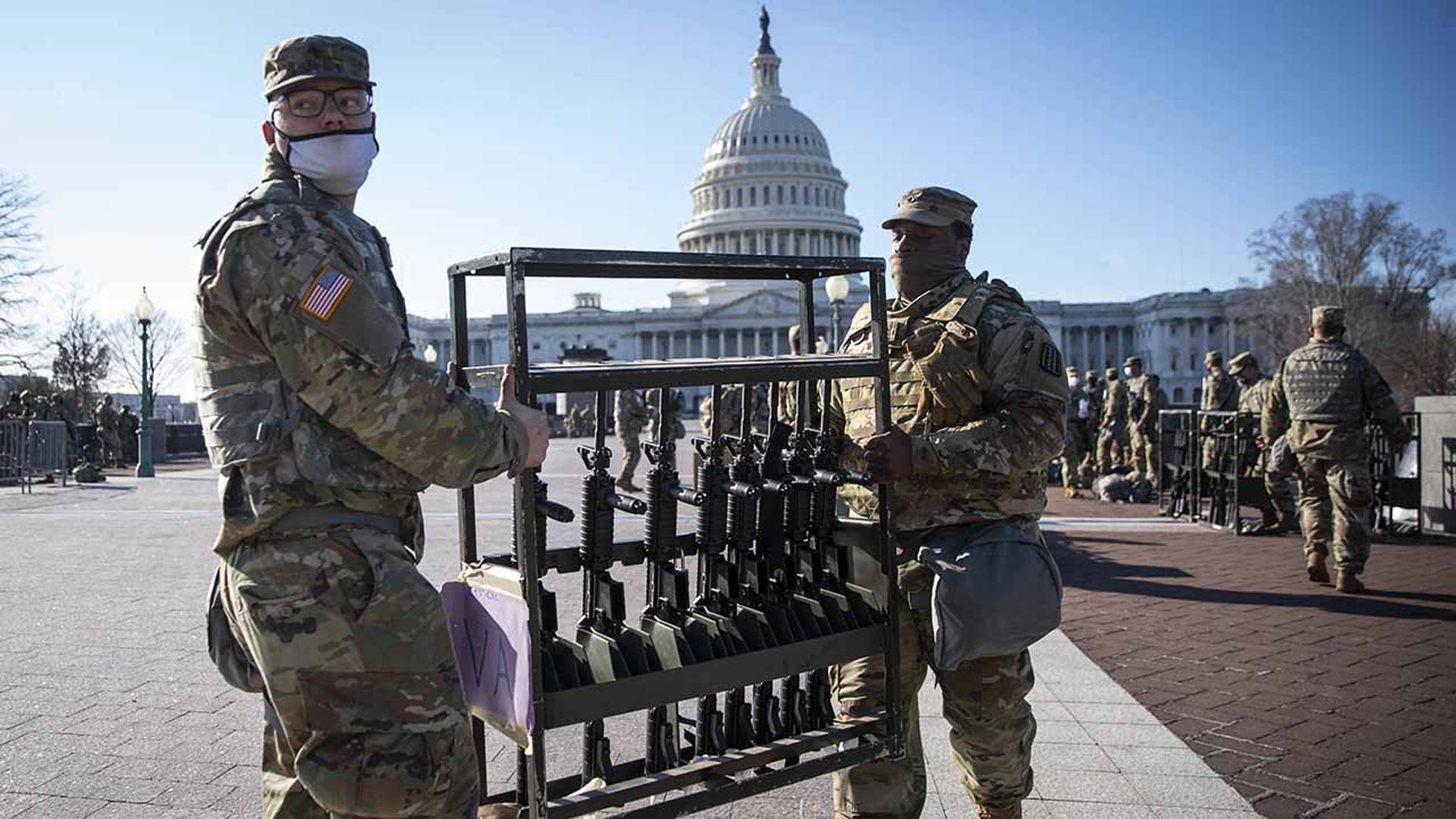 Members of the National Guard organize weapons outside of the U.S. Capitol in Washington, D.C., U.S., on Thursday, Jan. 14, 2021. President Trump's unprecedented second impeachment heads to the Senate, where his fate rests with Republican leader McConnell, who now has more leverage than ever over the president in his final week in office. (Sarah Silbiger/Bloomberg via Getty Images)