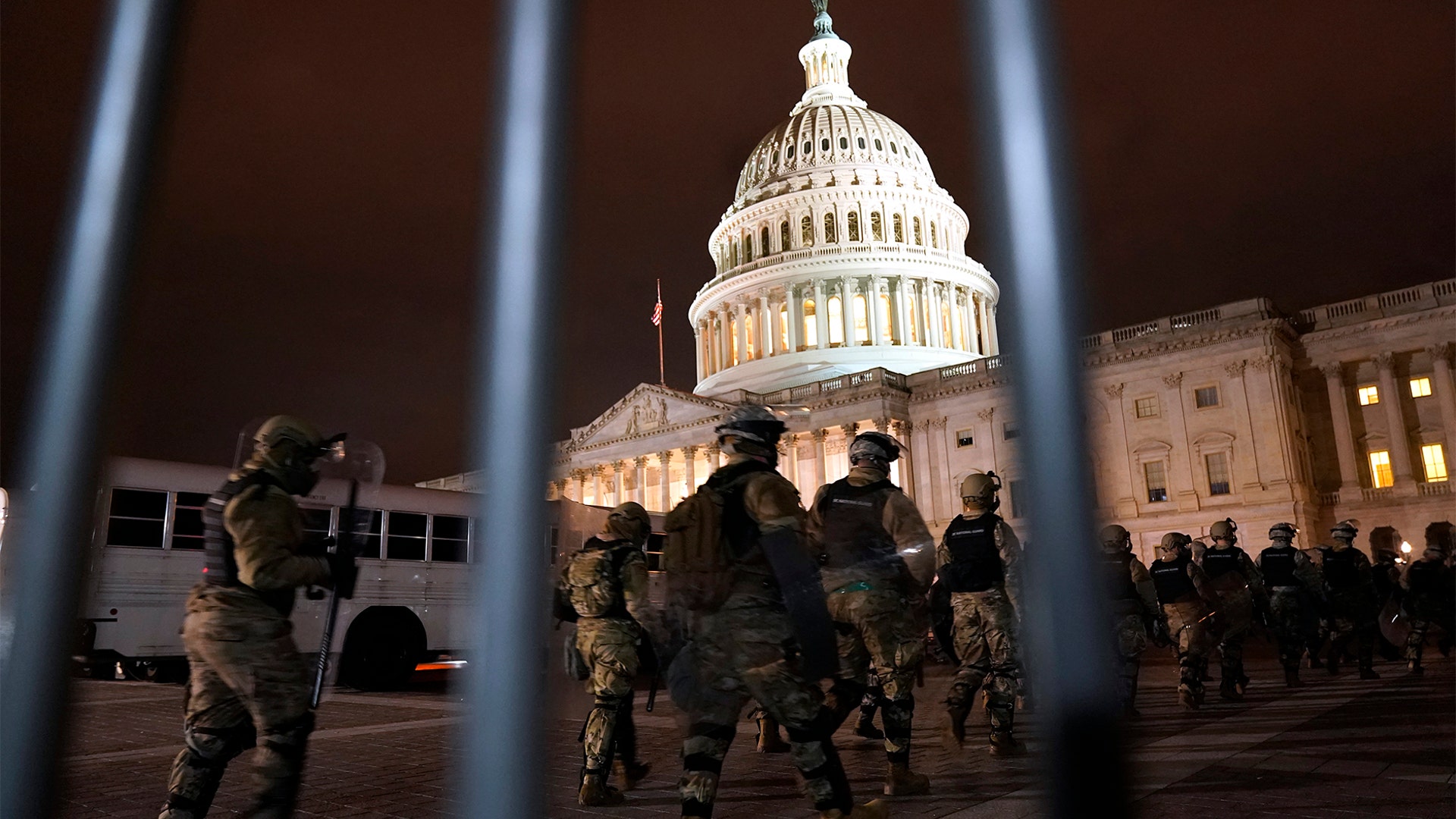 Members of the National Guard arrive to secure the area outside the U.S. Capitol, Wednesday, Jan. 6, 2021, in Washington.