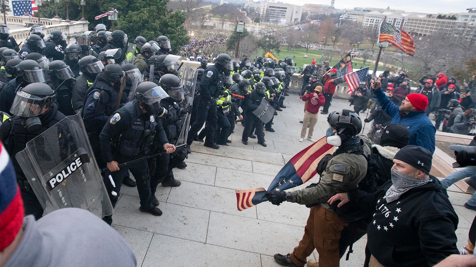 U.S. Capitol Police push back demonstrators who were trying to enter the U.S. Capitol on Wednesday, Jan. 6, 2021, in Washington.