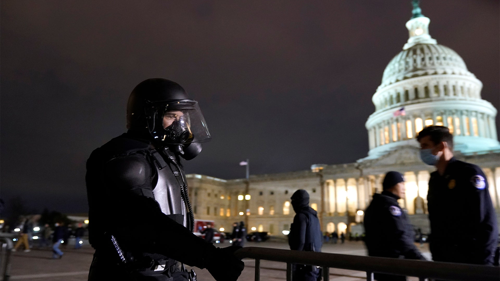 Authorities secure the area outside the U.S. Capitol, Wednesday, Jan. 6, 2021, in Washington.