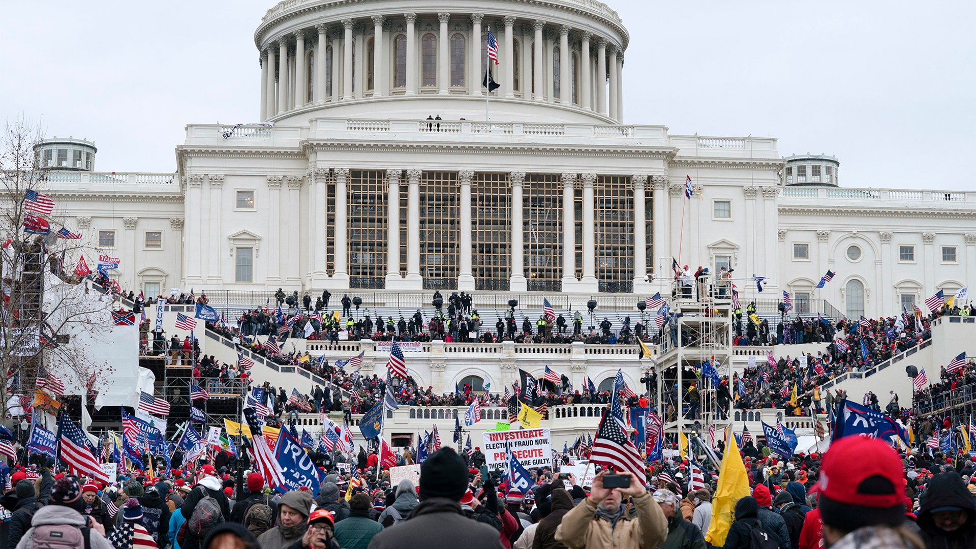 Trump supporters gather outside the Capitol, Wednesday, Jan. 6, 2021, in Washington. As Congress prepares to affirm President-elect Joe Biden's victory, thousands of people have gathered to show their support for President Trump and his claims of election fraud.