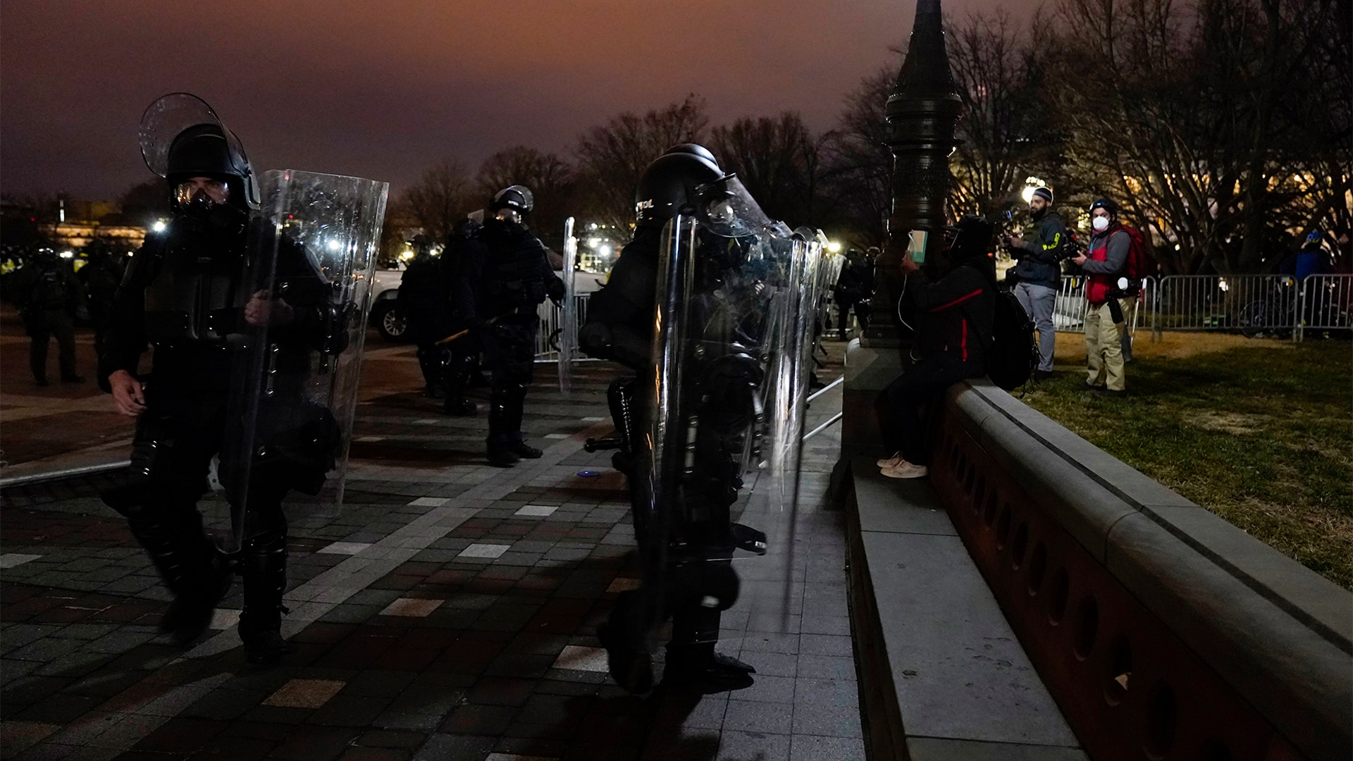 Authorities remove protesters from the U.S. Capitol, Wednesday, Jan. 6, 2021, in Washington.