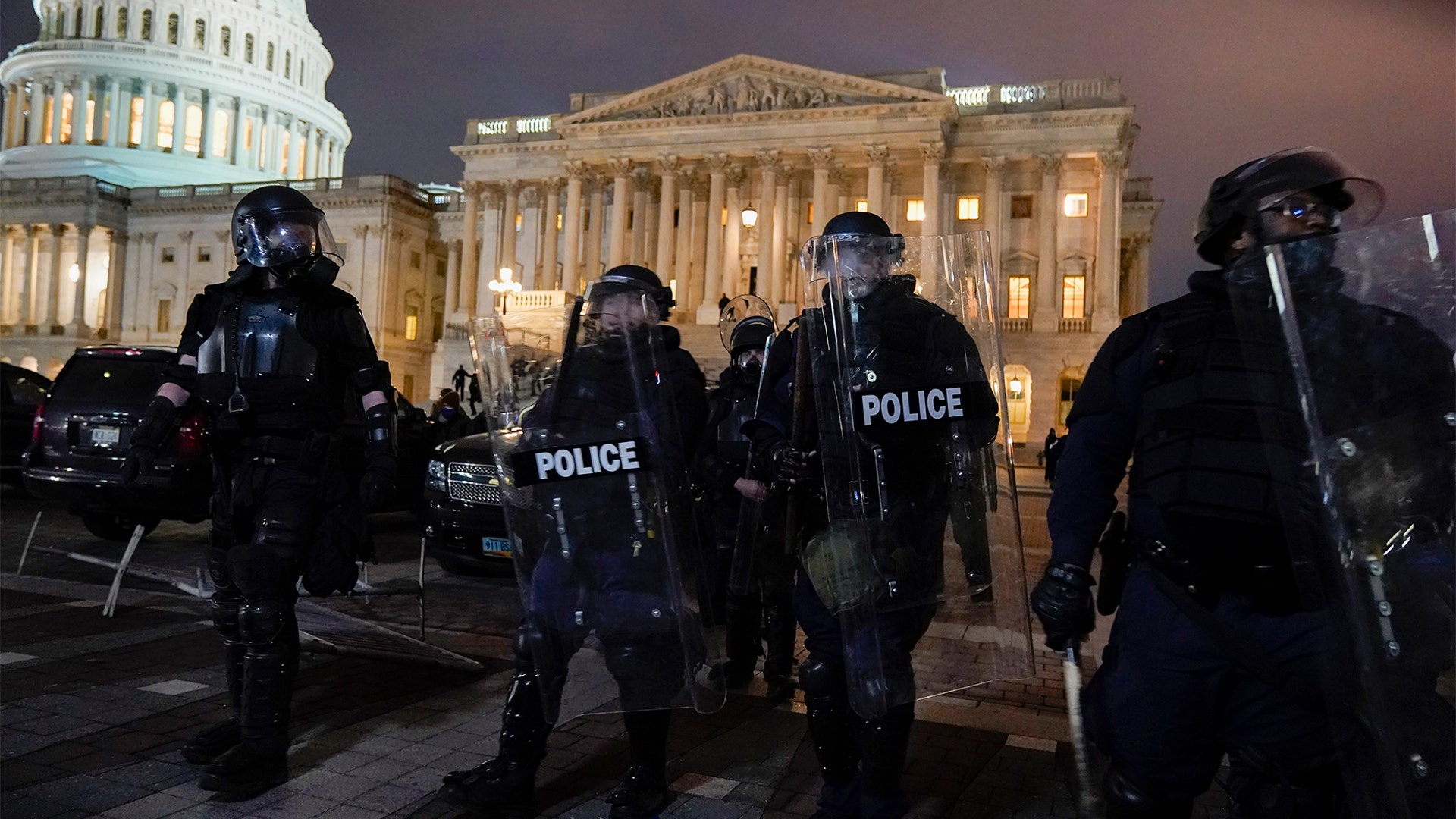 Authorities remove protesters from the U.S. Capitol, Wednesday, Jan. 6, 2021, in Washington.