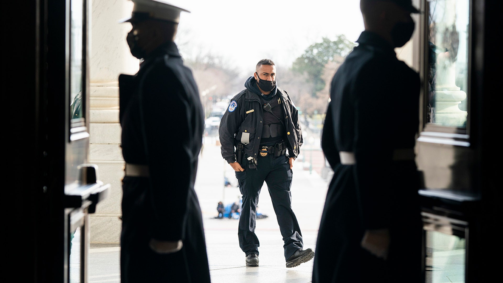U.S. Marine Corps. sentries and a U.S. Capitol Police officer, center, during a rehearsal for the 59th inaugural ceremony for President-elect Joe Biden and Vice President-elect Kamala Harris on Monday, January 18, 2021 at the U.S. Capitol in Washington.