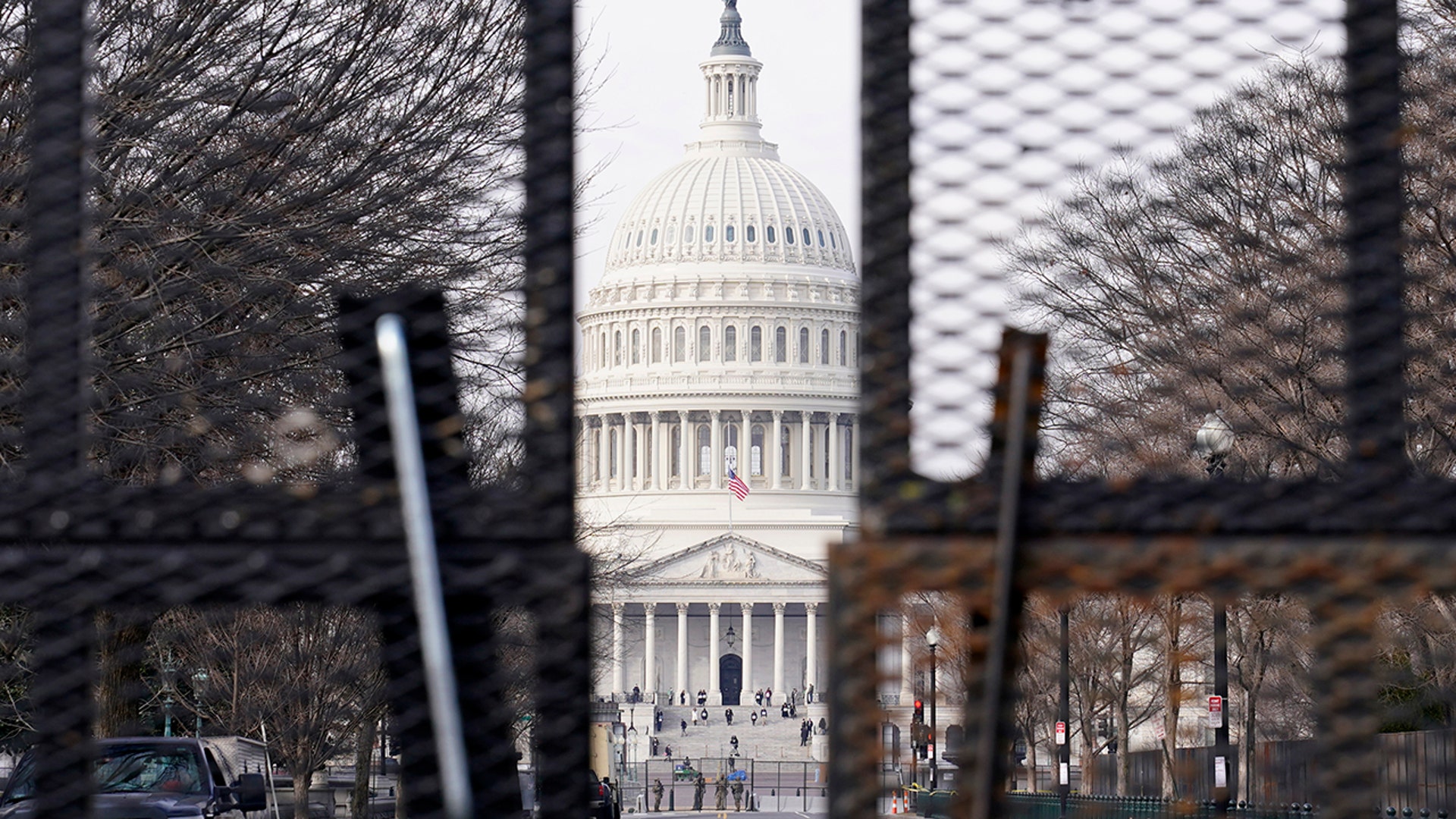 Security surrounds the U.S. Capitol in Washington, Friday, Jan. 15, 2021, ahead of the inauguration of President-elect Joe Biden and Vice President-elect Kamala Harris.