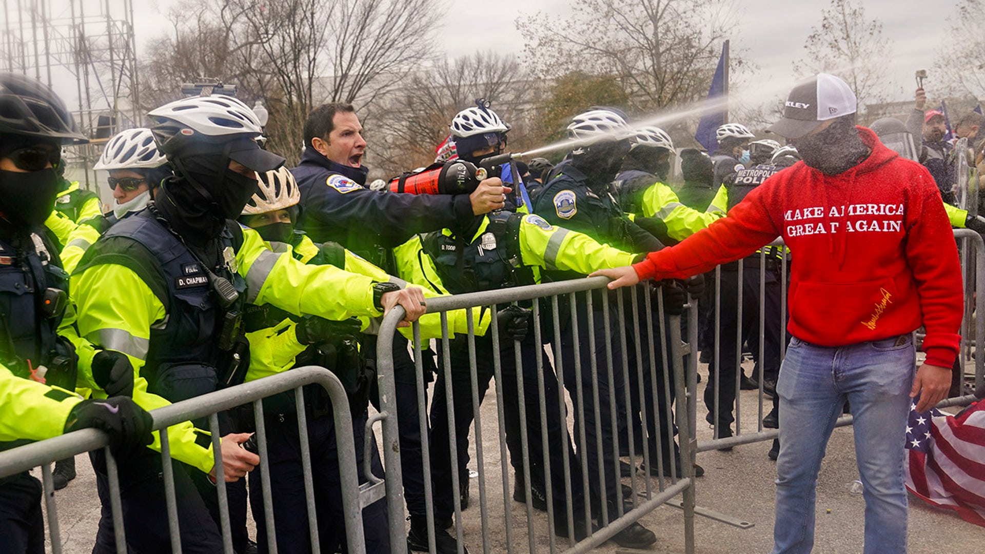 Demonstators loyal to President Trump are sprayed by police, Wednesday, Jan. 6, 2021, during a day of rioting at the Capitol. The mob of protesters descended on Washington, D.C., in an electoral protest, trying to keep President-elect Joe Biden from replacing Trump in the White House. 