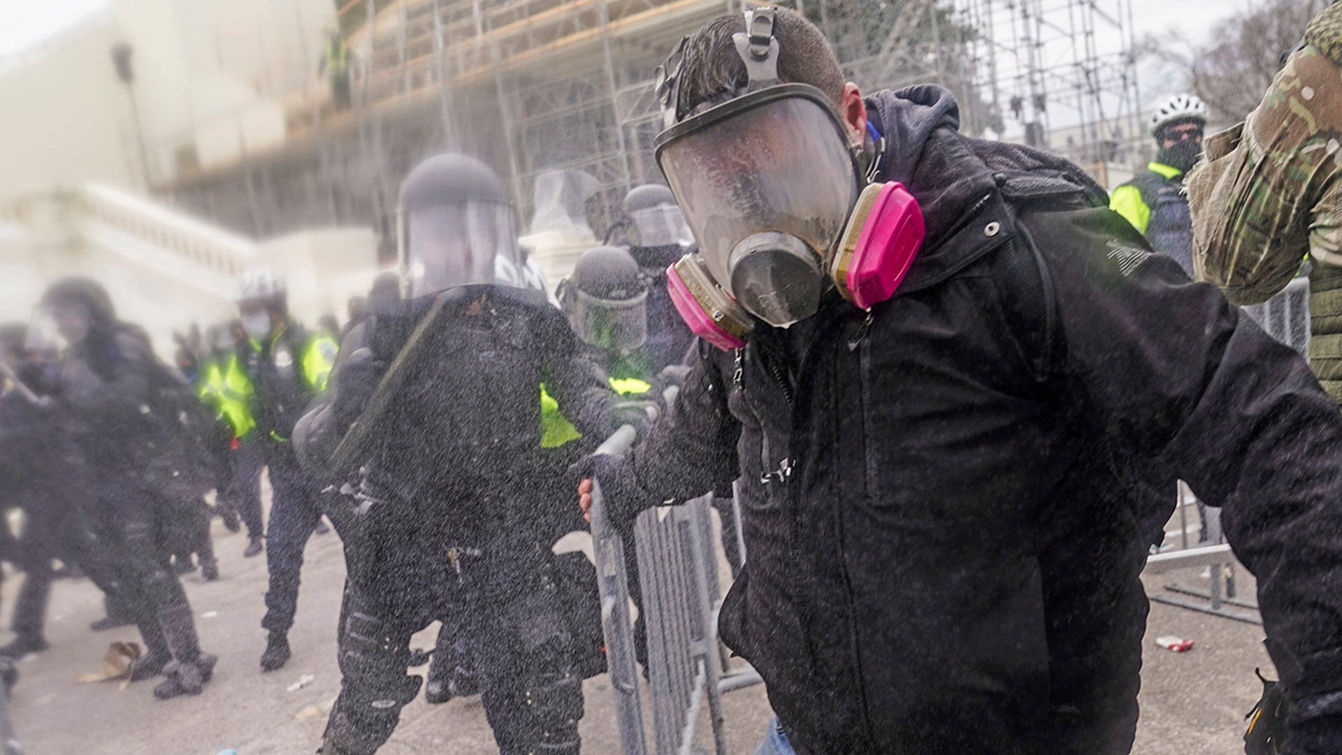 Trump supporters try to break through a police barrier, Wednesday, Jan. 6, 2021, at the Capitol in Washington. As Congress prepares to affirm President-elect Joe Biden's victory, thousands of people have gathered to show their support for President Trump and his claims of election fraud.